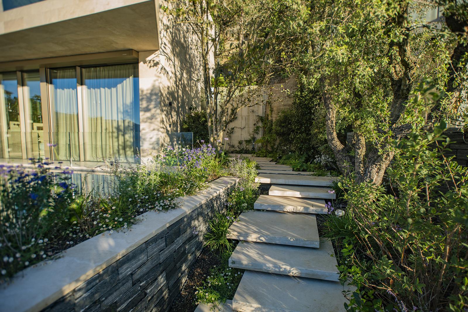 Natural stone slabs and Mediterranean planting