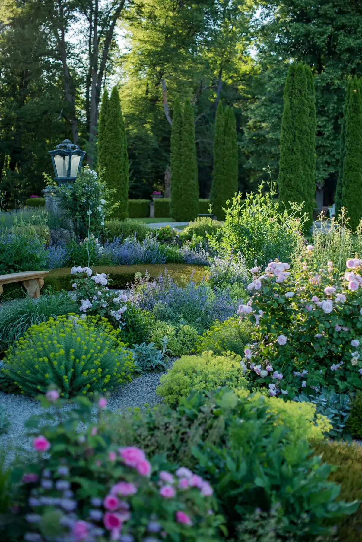 Castle garden with differentiated perennial planting and classical order.